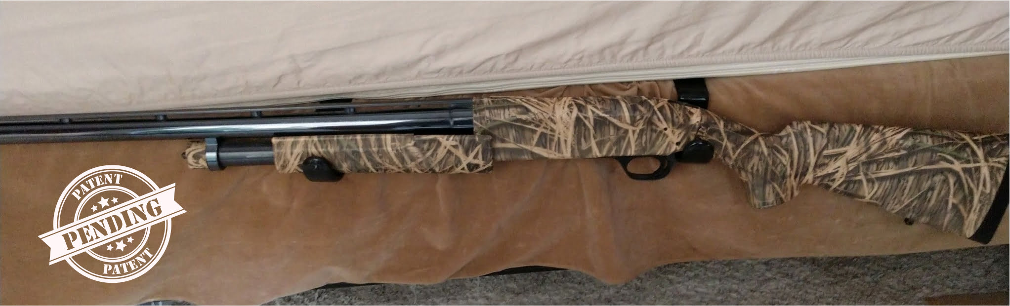 rifle being held by the site of the bed using the home defense tool holder